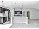 Island kitchen with granite counters, stainless steel appliances and dark cabinets at 963 Nw 65Th St, Ocala, FL 34475