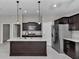 Spacious kitchen featuring an island, stainless steel refrigerator, and modern finishes at 963 Nw 65Th St, Ocala, FL 34475