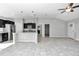 Open concept kitchen and living area with granite countertops and tile floors at 963 Nw 65Th St, Ocala, FL 34475