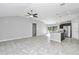 Open concept living area with tile flooring and a high ceiling at 963 Nw 65Th St, Ocala, FL 34475
