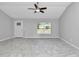 Bright living room featuring tile floors and a ceiling fan at 963 Nw 65Th St, Ocala, FL 34475