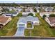 Aerial view of house, driveway and yard at 9802 Se 178Th Ln, Summerfield, FL 34491