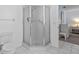 Bathroom with a corner shower and tile flooring at 9802 Se 178Th Ln, Summerfield, FL 34491