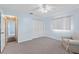 Spacious bedroom with neutral walls, carpet flooring, and ample closet space at 9802 Se 178Th Ln, Summerfield, FL 34491