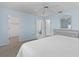 Bedroom with king-size bed, walk-in closet, and ensuite bathroom at 9802 Se 178Th Ln, Summerfield, FL 34491