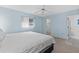 Light and airy bedroom with king-size bed and ceiling fan at 9802 Se 178Th Ln, Summerfield, FL 34491