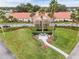 Community clubhouse with flag and landscaping at 9802 Se 178Th Ln, Summerfield, FL 34491