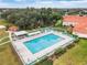 Resort-style community pool with lounge chairs at 9802 Se 178Th Ln, Summerfield, FL 34491