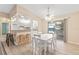 Dining area with white table and chairs, near kitchen at 9802 Se 178Th Ln, Summerfield, FL 34491