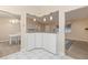 Kitchen features granite countertops and white cabinets at 9802 Se 178Th Ln, Summerfield, FL 34491