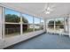 Sunroom with view of backyard and ceiling fan at 9802 Se 178Th Ln, Summerfield, FL 34491