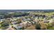 Aerial view of a residential neighborhood with a golf course nearby at 9910 Se 138Th Loop, Summerfield, FL 34491