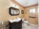 Clean bathroom with single vanity and shower/tub combo at 9910 Se 138Th Loop, Summerfield, FL 34491