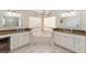 Spacious bathroom with double sinks, corner tub, and updated fixtures at 9910 Se 138Th Loop, Summerfield, FL 34491