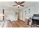 Bedroom with workspace and ceiling fan at 9910 Se 138Th Loop, Summerfield, FL 34491