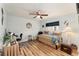 Bedroom with daybed, workspace, and ceiling fan at 9910 Se 138Th Loop, Summerfield, FL 34491