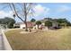 Single-story home with landscaped yard and driveway at 9910 Se 138Th Loop, Summerfield, FL 34491