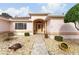 Welcoming front entry with a paved walkway and landscaping at 9910 Se 138Th Loop, Summerfield, FL 34491