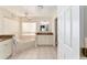 Hallway with two closets and bathroom access at 9910 Se 138Th Loop, Summerfield, FL 34491