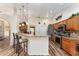 Open kitchen with granite counters, stainless steel appliances and breakfast bar at 9910 Se 138Th Loop, Summerfield, FL 34491