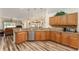 Kitchen boasts granite countertops, wood cabinets, and stainless steel dishwasher at 9910 Se 138Th Loop, Summerfield, FL 34491
