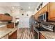 Spacious kitchen with granite countertops and stainless steel appliances at 9910 Se 138Th Loop, Summerfield, FL 34491