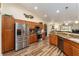 Updated kitchen featuring stainless steel appliances, granite counters and wood cabinets at 9910 Se 138Th Loop, Summerfield, FL 34491