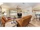 Relaxing living room featuring leather recliners and a large-screen TV at 9910 Se 138Th Loop, Summerfield, FL 34491