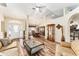 Open living room with hardwood floors, high ceilings and views to dining and kitchen areas at 9910 Se 138Th Loop, Summerfield, FL 34491