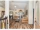 Bright and spacious living room with hardwood floors and access to other rooms at 9910 Se 138Th Loop, Summerfield, FL 34491