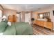 Main bedroom with king-size bed and en-suite bathroom access at 9910 Se 138Th Loop, Summerfield, FL 34491