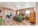 Main bedroom with a king-size bed, wood dresser, and access to a private patio at 9910 Se 138Th Loop, Summerfield, FL 34491