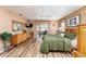 Main bedroom with king bed, dresser, and access to the back patio at 9910 Se 138Th Loop, Summerfield, FL 34491