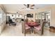 Sunroom with dining area and access to backyard at 9910 Se 138Th Loop, Summerfield, FL 34491