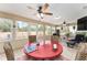 Bright sunroom with ample seating and scenic views at 9910 Se 138Th Loop, Summerfield, FL 34491