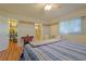 Bright bedroom with hardwood floors and ceiling fan at 10185 Se 175Th Ln, Summerfield, FL 34491