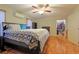 Spacious bedroom with wood floors, walk-in closet, and ceiling fan at 10185 Se 175Th Ln, Summerfield, FL 34491