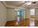 Spacious bedroom featuring hardwood floors and an ensuite bathroom at 10185 Se 175Th Ln, Summerfield, FL 34491