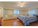 Bright bedroom with hardwood floors and ceiling fan at 10185 Se 175Th Ln, Summerfield, FL 34491