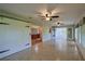 A spacious bonus room featuring large sliding barn doors and tile floors, great for flexible living at 10185 Se 175Th Ln, Summerfield, FL 34491