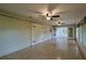 A spacious bonus room featuring large sliding barn doors and tile floors, great for flexible living at 10185 Se 175Th Ln, Summerfield, FL 34491