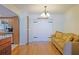 Bright dining area with hardwood floors and view to kitchen at 10185 Se 175Th Ln, Summerfield, FL 34491