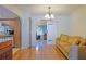 Bright dining area with hardwood floors and view to kitchen at 10185 Se 175Th Ln, Summerfield, FL 34491