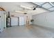 Garage featuring overhead lighting and plenty of storage space at 10185 Se 175Th Ln, Summerfield, FL 34491