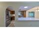 Open-concept kitchen featuring stainless steel appliances and a granite-topped island at 10185 Se 175Th Ln, Summerfield, FL 34491