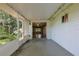 Spacious screened lanai connecting the indoor living space to the backyard at 10185 Se 175Th Ln, Summerfield, FL 34491