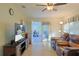 Living room with leather furniture and access to screened porch at 10185 Se 175Th Ln, Summerfield, FL 34491