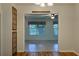 Spacious living room featuring neutral colored walls and tiled floors at 10185 Se 175Th Ln, Summerfield, FL 34491