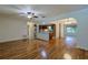 Spacious living room with hardwood flooring and arched doorways lead to other rooms at 10185 Se 175Th Ln, Summerfield, FL 34491