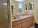 Clean bathroom with pink vanity and shower at 10736 Sw 62Nd Ave, Ocala, FL 34476